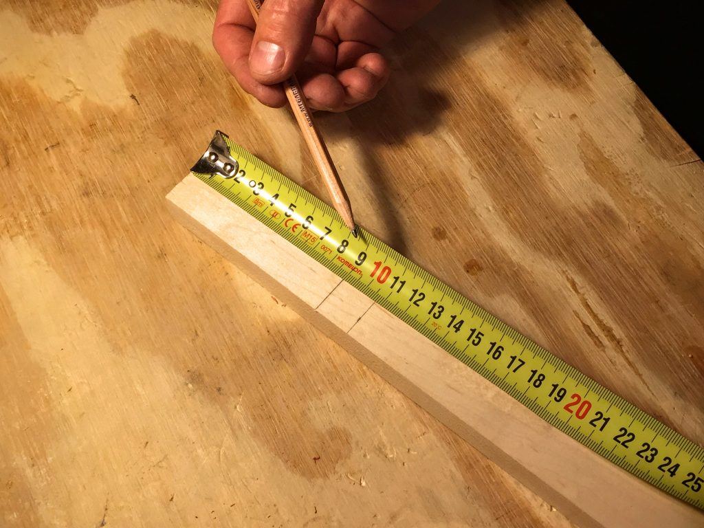 measure down from the top of the neck to the bottom of the headstock