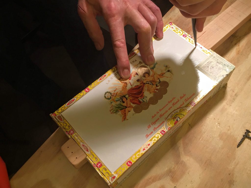 poke guide-holes in the box lid