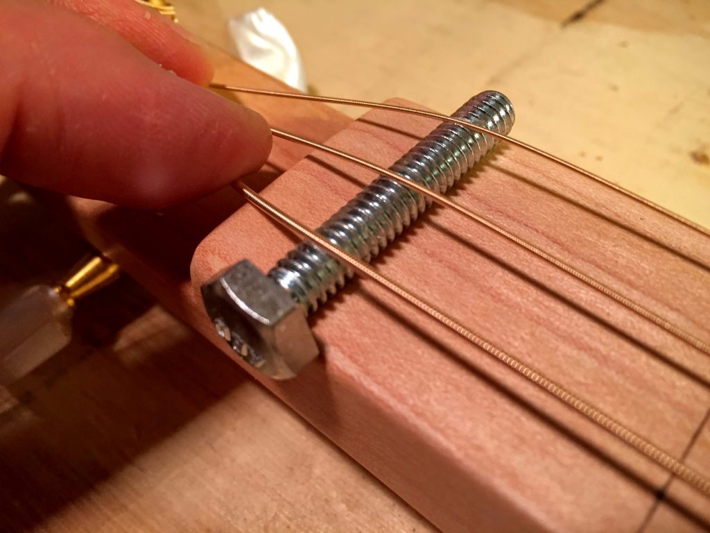 space the strings over the nut